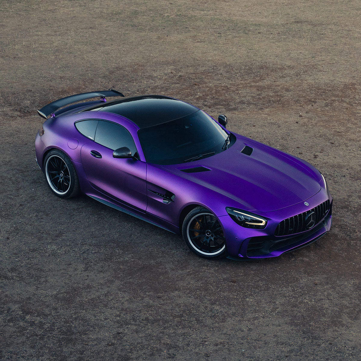 Mercedes-AMG GT wrapped in Matte Metallic Eminence Purple vinyl wrap upper view.