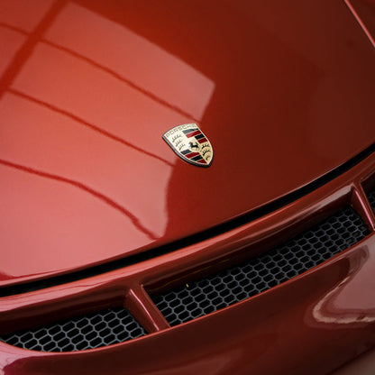 Porsche wrapped in Glossy Metallic Cherry Red vinyl wrap.